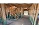 Interior view of the home's framing, showing the staircase and open-concept layout on the main level at 91 Gobbler Dr, Smithfield, NC 27577