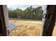 Exterior framing with a natural wooded view and ground awaiting landscaping design at 91 Gobbler Dr, Smithfield, NC 27577