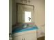Bathroom with white cabinets, modern fixtures, and a large mirror at 10 Silver Ct, Smithfield, NC 27577