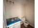 Half-bathroom featuring a modern vanity with granite countertop and toilet at 10 Silver Ct, Smithfield, NC 27577