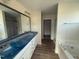 Bathroom with dual sink vanity and a separate tub and shower at 10 Silver Ct, Smithfield, NC 27577