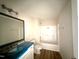 Bathroom with a tub and shower combination and updated fixtures at 10 Silver Ct, Smithfield, NC 27577