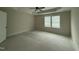 Spacious bedroom with a tray ceiling and large window at 10 Silver Ct, Smithfield, NC 27577