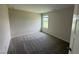 Bedroom featuring carpet, a window, and neutral colored walls at 10 Silver Ct, Smithfield, NC 27577