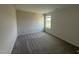 Cozy bedroom with carpeting and a large window providing natural light at 10 Silver Ct, Smithfield, NC 27577