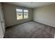 Bedroom featuring carpet, a window, and neutral colored walls at 10 Silver Ct, Smithfield, NC 27577
