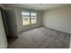This cozy carpeted bedroom offers a bright window, creating a comfortable retreat at 10 Silver Ct, Smithfield, NC 27577