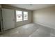 Bedroom with a double window for natural light and an access door at 10 Silver Ct, Smithfield, NC 27577