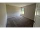 Carpeted bedroom features a window for natural light at 10 Silver Ct, Smithfield, NC 27577