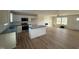 Bright kitchen featuring white cabinets, stainless steel appliances, and a center island at 10 Silver Ct, Smithfield, NC 27577