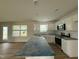 Modern kitchen with white cabinets, stainless steel appliances and center island at 10 Silver Ct, Smithfield, NC 27577