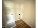 Laundry room includes wood floors, a utility sink, and washer and dryer hookups at 10 Silver Ct, Smithfield, NC 27577