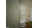 Well-lit laundry room with washer and dryer hookups and plenty of shelving at 10 Silver Ct, Smithfield, NC 27577