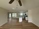 Bright open-concept living room and kitchen with modern wood-look floors and lots of light at 10 Silver Ct, Smithfield, NC 27577
