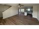 Open-concept living area with wood flooring flowing into the bright kitchen at 10 Silver Ct, Smithfield, NC 27577