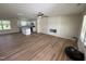 Spacious living room and kitchen area with modern appliances, a kitchen island, and wood flooring at 10 Silver Ct, Smithfield, NC 27577