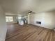 Spacious living room open to the kitchen features a ceiling fan and modern fireplace at 10 Silver Ct, Smithfield, NC 27577