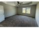 Spacious primary bedroom features a trey ceiling, ceiling fan, carpet flooring, and a double window at 10 Silver Ct, Smithfield, NC 27577