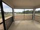 Screened-in porch overlooking a beautiful yard and view at 10 Silver Ct, Smithfield, NC 27577