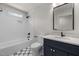 Charming bathroom with tub and shower, subway tile, and stylish vanity at 1005 Forrestal Pl, Durham, NC 27707