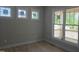Light-filled bedroom with three windows providing ample natural light and views of the outdoors at 1005 Forrestal Pl, Durham, NC 27707
