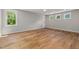 Spacious bedroom with hardwood floors, ample natural light, and neutral paint at 1005 Forrestal Pl, Durham, NC 27707