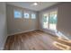 Bright bedroom with hardwood floors and multiple windows at 1005 Forrestal Pl, Durham, NC 27707