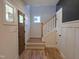 Inviting entryway with hardwood floors, staircase, and neutral paint at 1005 Forrestal Pl, Durham, NC 27707