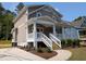 Beautiful exterior featuring a welcoming front porch and well-maintained landscaping at 1005 Forrestal Pl, Durham, NC 27707
