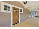 Close-up of the front door, showcasing the wooden door, house number, and covered porch at 1005 Forrestal Pl, Durham, NC 27707
