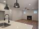 Open-concept living room with hardwood floors and a fireplace at 1005 Forrestal Pl, Durham, NC 27707
