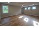Bright main bedroom with hardwood floors and recessed lighting at 1005 Forrestal Pl, Durham, NC 27707