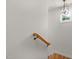 Staircase with a wooden handrail and a window letting in natural light at 1005 Forrestal Pl, Durham, NC 27707