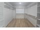Organized walk-in closet with custom shelving and ample storage, maximizing space and functionality at 1005 Forrestal Pl, Durham, NC 27707