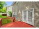 Back deck and patio doors leading to the home's fenced in backyard at 101 Hay Sedge Ct, Durham, NC 27705