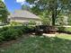 Charming community bench nestled in lush green space of a well-manicured lawn at 101 Hay Sedge Ct, Durham, NC 27705