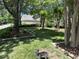 Community park with green grass, shade trees, and benches at 101 Hay Sedge Ct, Durham, NC 27705