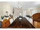 Spacious dining room featuring a large dining table, hardwood floors, and neutral wall colors at 101 Hay Sedge Ct, Durham, NC 27705