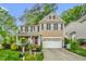 Charming two-story home featuring a classic design, a two-car garage, and a welcoming front porch at 101 Hay Sedge Ct, Durham, NC 27705