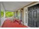 Charming front porch featuring rocking chairs, a small bench, and a welcoming entrance at 101 Hay Sedge Ct, Durham, NC 27705