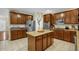 Spacious kitchen featuring stainless steel appliances, granite countertops, and central island at 101 Hay Sedge Ct, Durham, NC 27705