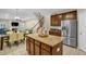 Open kitchen with stainless steel appliances, center island, and breakfast area at 101 Hay Sedge Ct, Durham, NC 27705