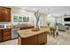 Bright kitchen featuring stainless steel appliances, island, and breakfast area at 101 Hay Sedge Ct, Durham, NC 27705