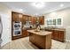 Well-equipped kitchen featuring stainless steel appliances, granite countertops, and center island at 101 Hay Sedge Ct, Durham, NC 27705