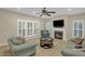 Inviting living room with a fireplace, large windows, and neutral decor at 101 Hay Sedge Ct, Durham, NC 27705
