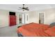 Spacious main bedroom with a ceiling fan, gray carpet, and a red dresser at 101 Hay Sedge Ct, Durham, NC 27705