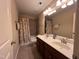 Bathroom with double sink vanity and shower with curtain at 102 Revere Forest Ct, Cary, NC 27519