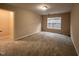 Bedroom featuring neutral carpet, one window, and a large walk in closet at 102 Revere Forest Ct, Cary, NC 27519