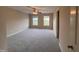 Bedroom featuring neutral carpet, neutral walls, ceiling fan and lots of natural light at 102 Revere Forest Ct, Cary, NC 27519