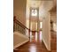 Elegant foyer with high ceilings, chandelier, staircase and hardwood floors at 102 Revere Forest Ct, Cary, NC 27519